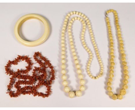 IVORY ETC. A stick coral necklace, a carved bone necklace, an Art Deco ivory bangle & a string of 1920's graduated ivory bead