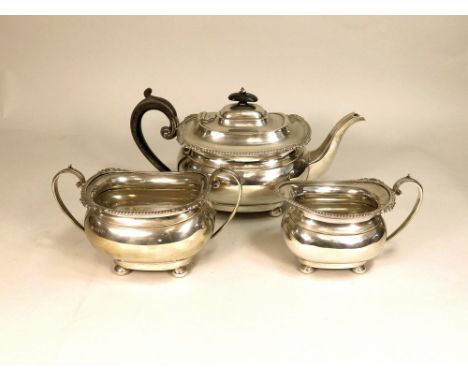 TEA SERVICE. An Edwardian three piece tea service. London 1909. Approx. 38oz.
