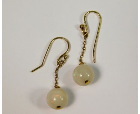 OPAL EARRINGS. A pair of opal bead earrings on 9ct. gold chain &amp; hooks. (Beads approx. 12ct.).