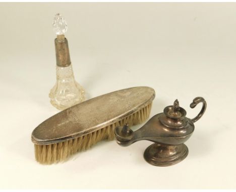 BRUSH ETC. A silver mounted bristle brush, a silver mounted scent bottle (a.f.) &amp; a 1940's silver table lighter.