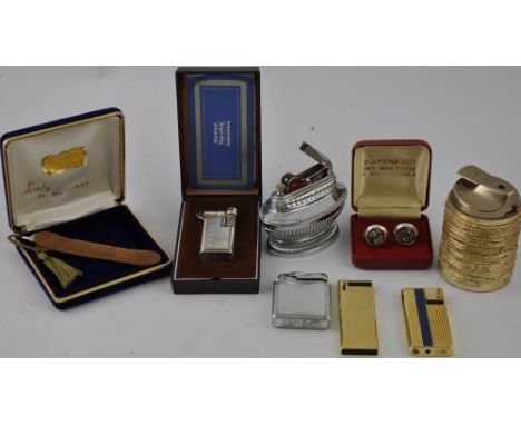 A collection of lighters including a Dupont roller lighter with a square cross-hatched body, various Ronson and other makes, 
