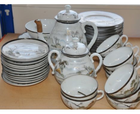 A Japanese eggshell ware tea service, decorated with landscape scenes.