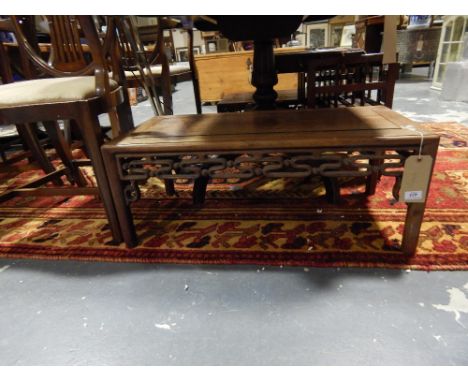 Two early 20th Century Chinese hardwood low occasional tables with pierced scroll friezes, L. 80cm.