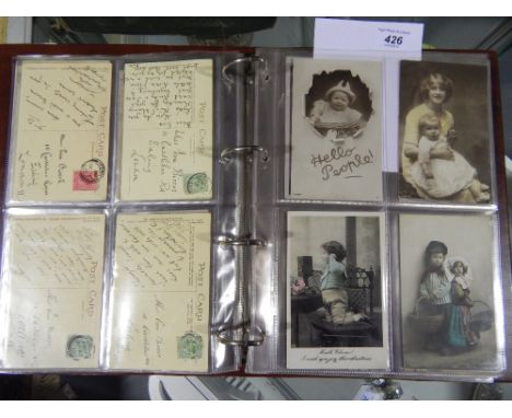 An album of Edwardian postcards, approx 120, unusually sent by one family, including actresses portrait cards, topographical 