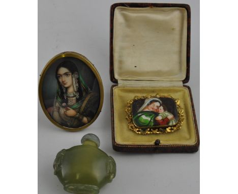 An Oriental hardstone snuff bottle, carved with lion mask handles, H. 6cm; together with a miniature portrait of Mumtaz Mahal