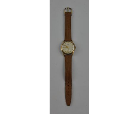 A 1950s Swiss vertex revue 9ct gentleman's wristwatch with subsidiary seconds dial within Arabic and baton numerals.