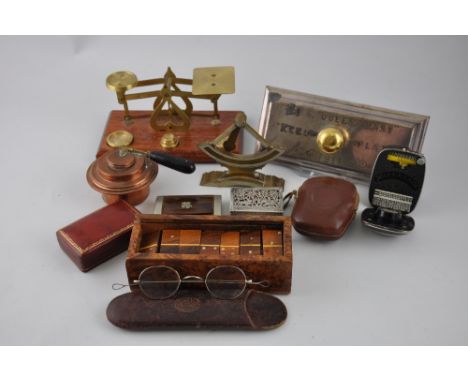 A desk weight, formed from a keel plate of RMS Queen Mary, of moulded rectangular form silver plated with a brass knob handle