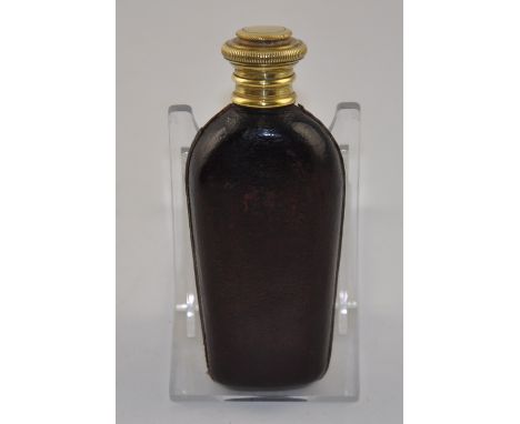 A ladies 20th Century tan leather spirit flask with hinged brass cover, H. 10cm.