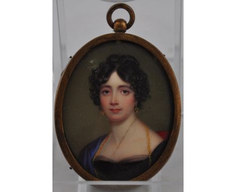 A late Victorian/Edwardian oval portrait miniature, possibly on ivory, depicting a young lady in blue silk shawl. H. 5.5cm.