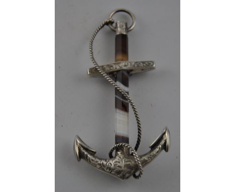 A Victorian white metal and agate cloak pin modelled as a rope bound anchor, H. 8.5cm. (lacking pin).