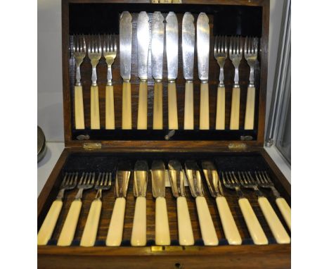 A cased set of twelve Edwardian silver plated fish knives and forks, together with an earlier plated fiddle and shell pattern