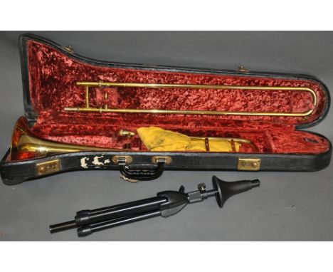 A Zenith Deluxe slide trombone, in fitted case, together with a modern tripod stand, (2)