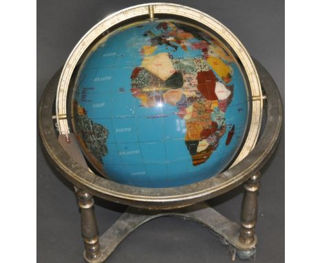 A hardstone globe, within a plated frame. W. 51cm.