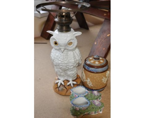 A Royal Doulton tobacco jar of barrel form, together with two flower encrusted ceramic shoes  and a Lamp base in the form of 