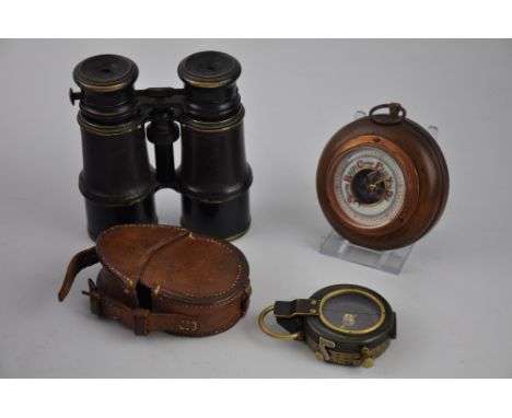 A prismatic compass by Richardson & Co. London, dated 1917, in a tan leather case, together with a pair of field glasses, fit