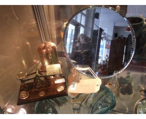 A set of brass postal scales, a brass and copper tea cannister and a circular mirror with faceted rim. (3)