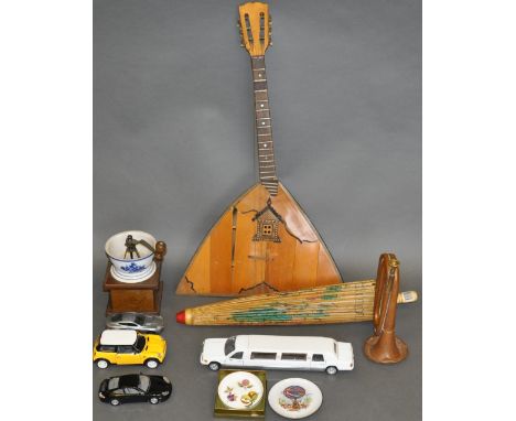 A six-string prima balalika, a paper parasol, various die-cast toys, a bugle and a coffee grinder. 