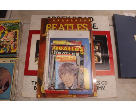 A collection of Beatles ephemera to include some period magazines, newspapers, a collection of Disc and New Musical Express m