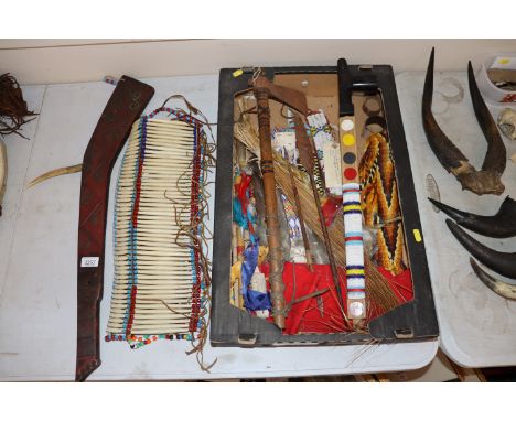 A collection of various Native North American items to include a decorative peace pipe, tomahawk, spears and other items