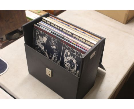 A quantity of Rolling Stones LP's and Band Members solo LP's contained in a carrying case