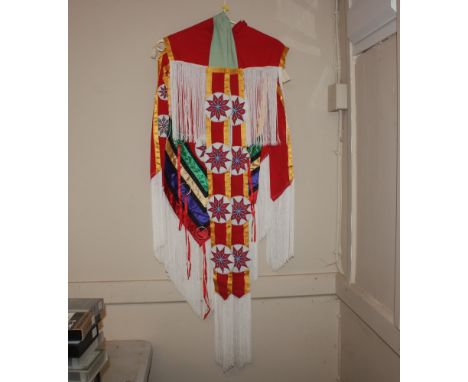 A Native North American Indian beadwork and tasselled shirt and sash