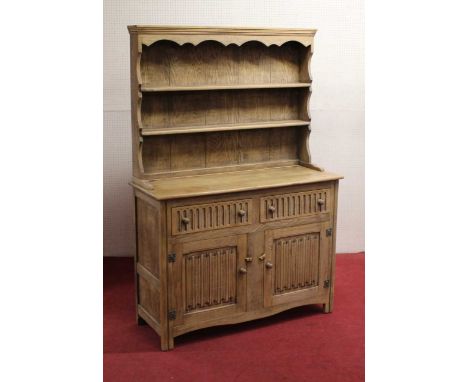 A contemporary light oak linenfold dresser, width 121cm