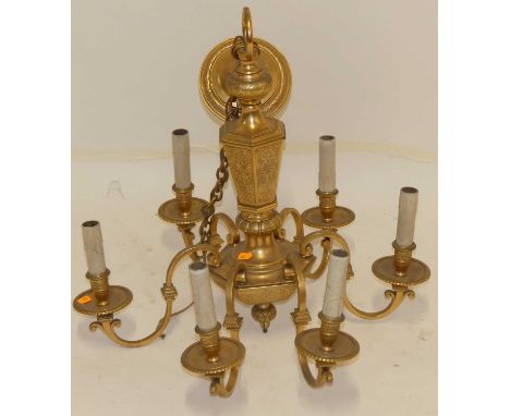 A French gilt brass six light hanging electrolier, having turned hexagonal column with all over floral engraved detail, appro