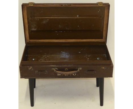 A vintage painted metal low occasional table, the top in the form of a suitcase with hinged compartment on turned supports, w