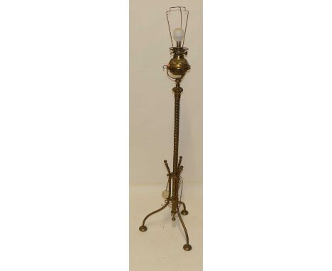 An Edwardian spiral turned gilt brass standard lamp, having rise-and-fall action