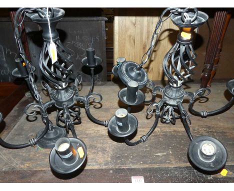 A pair of contemporary black painted metal hanging five-light electroliers