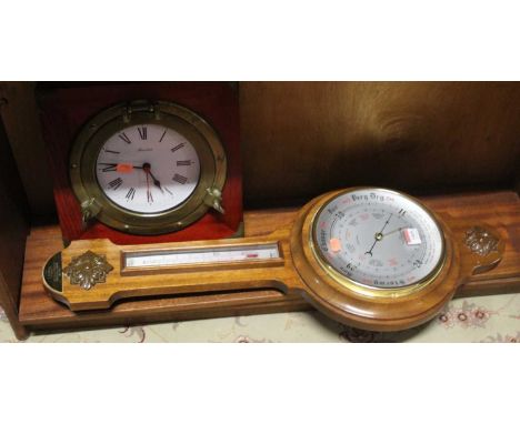 A contemporary aneroid two-dial wheel barometer, together with a reproduction marine wall clock (2)