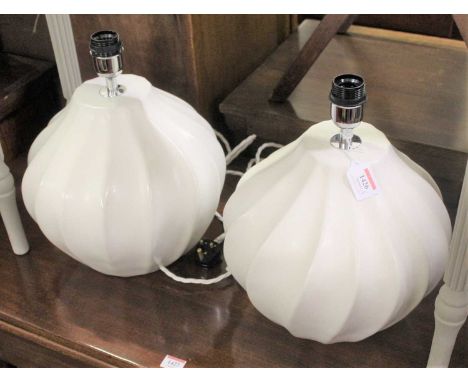 A pair of contemporary white glazed ceramic table lamps by Heathfield &amp; Co. each of squat fluted form with cylindrical sh