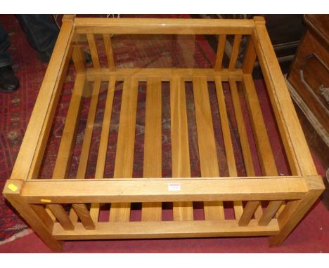 A contemporary light oak square coffee table, having glass inset top and slatted undertier, w.85cmCondition report: Overall g