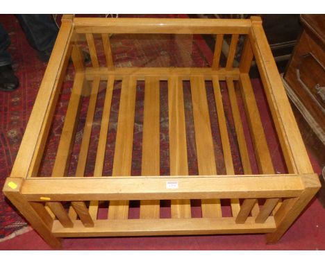 A contemporary light oak square coffee table, having glass inset top and slatted undertier, w.85cmCondition report: Overall g