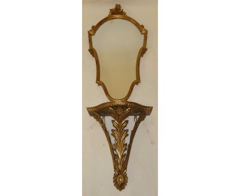 A contemporary gilt wood shaped wall mirror with floral decoration, 94 x 48.5cm, together with a near matching gilt wood Serp