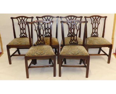 A set of six Chippendale style mahogany dining chairs, each having floral geometric upholstered drop-in pad seats, circa 1900