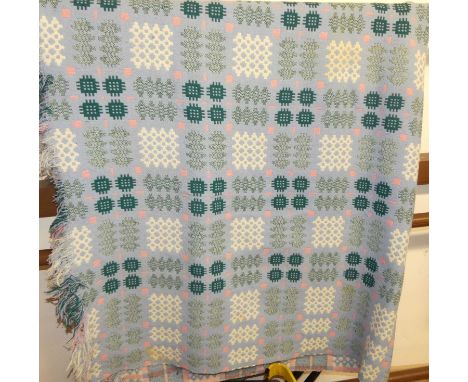 A large Welsh woollen throw by Derw, pale blue ground with all over geometric decoration, with labelCondition report: Some li