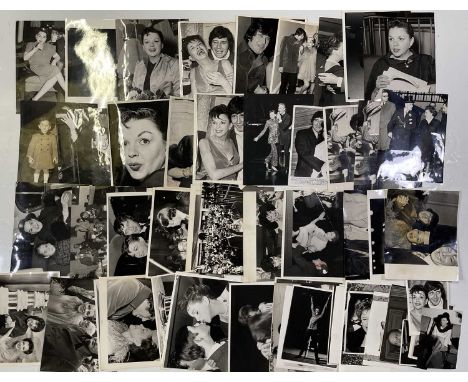 Approx 63 variously sized (many c 8x10") black and white press photographs depicting Judy Garland, many vintage prints with p