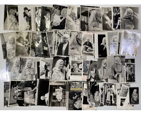 Approx 105 variously sized black and white press photographs depicting Diana Dors, many vintage prints with press stamps/info