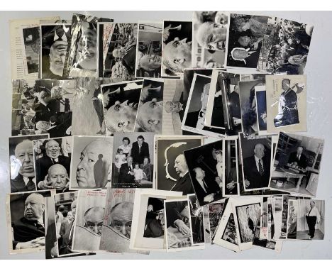 Approx 75 variously sized black and white press photographs depicting Alfred Hitchcock, many vintage prints with press stamps