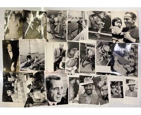 Approx 24 variously sized (many c 8x10") black and white press photographs depicting Humphrey Bogart, many vintage prints wit