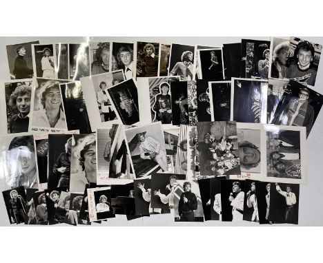 Approx 72 variously sized black and white press photographs depicting Barry Manilow, many vintage prints with press stamps/in