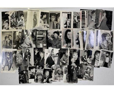 Approx 92 variously sized black and white press photographs depicting Shirley Maclaine, many vintage prints with press stamps