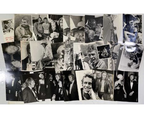 Approx 34 variously sized black and white press photographs depicting Steve McQueen, many vintage prints with press stamps/in
