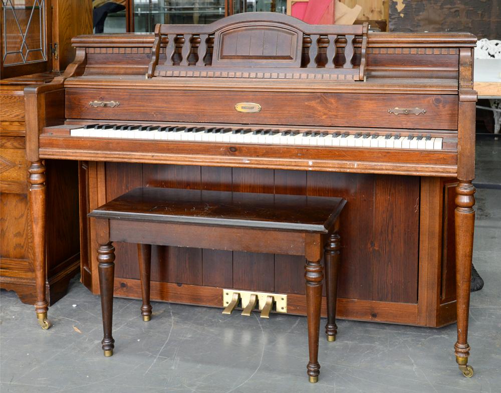 A LOWREY STAINED WOOD UPRIGHT PIANO AND A STAINED WOOD MUSIC STOOL