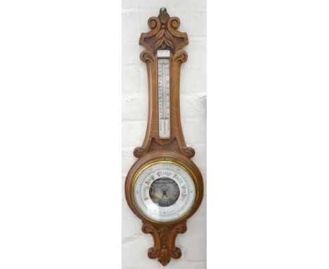 AN OAK ANEROID BAROMETER, INCORPORATING A THERMOMETER 