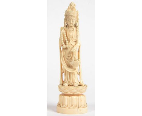 A JAPANESE IVORY FIGURE OF KANNON ON LOTUS BASE, 21CM H, SIGNED, EARLY 20TH C