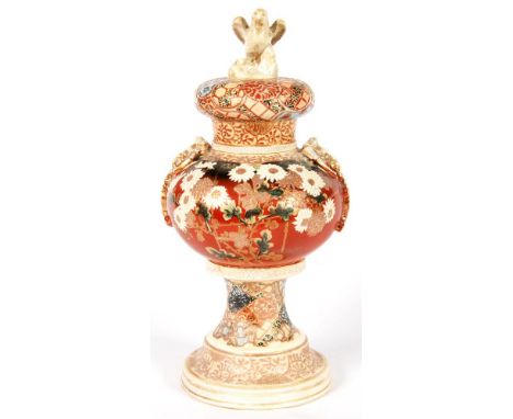 A JAPANESE GLOBULAR SATSUMA WARE VASE AND COVER, WITH EAGLE FINIAL AND BAT HANDLES, 34CM H,  MEIJI PERIOD 