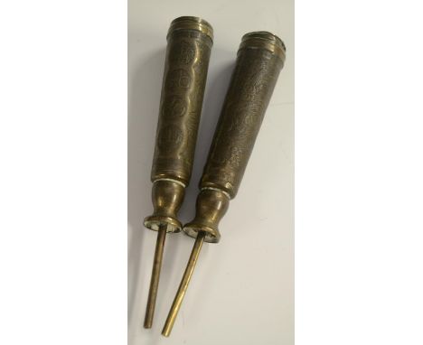 A pair of 19th century Chinese brass scroll or banner holders, chased with characters and ferocious dragons amongst scrolling