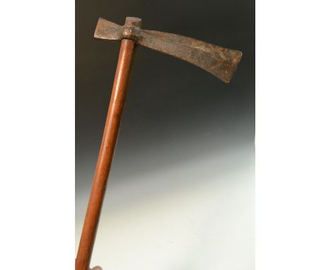 Tribal Art - an African axe, 18.5cm iron head with central ridge, the shaft incise carved to the grip, 78cm long